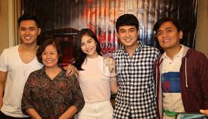 Direk Jun Lana with cast of "Haunted Mansion" with producer Lily Monteverde.